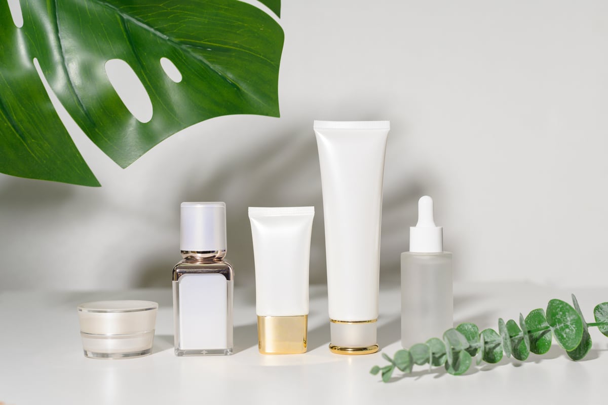 Series of new skincare products among greenery